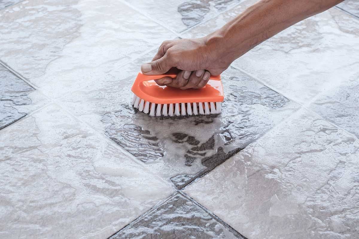 cleaning tile floor GettyImages 1194058734